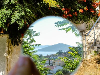 View from a window of a calm outdoor scene, symbolizing focus.